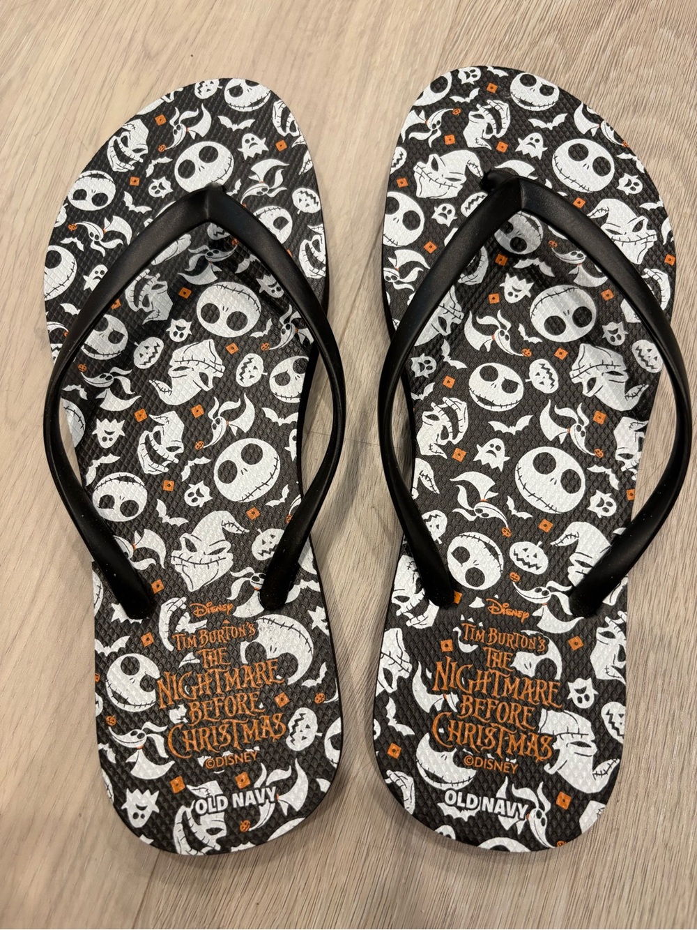 Old Navy Black & White Nightmare Before Christmas Flip Flops with Orange Accents